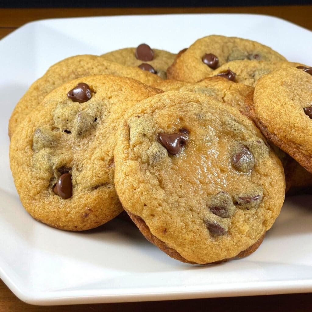 Soft and fluffy chewy chocolate chip cookies on a white octagonal plate