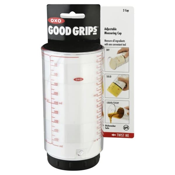 This adjustable measuring cup is a white cylinder with a black top top. This is the plunger part.  Then there is a peice around it that is clear with red tick marks for measurements.  I used this to measure out the peanut butter for my peanut butter cookies.